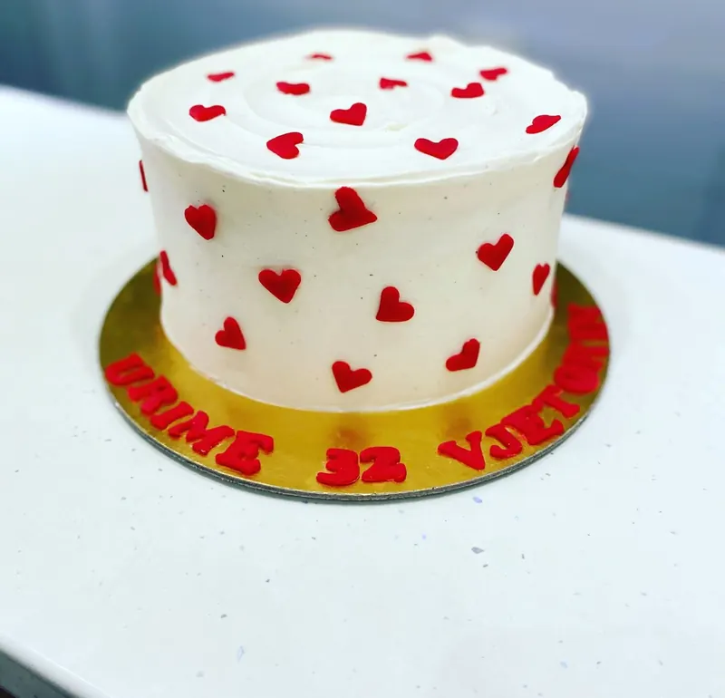 Birthday cake with red sugar hearts